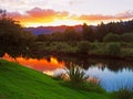 Sunset over a tranquil stream Royalty Free Stock Photo