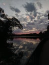 Sunset Over Trees Mirroring Off Glass Like Water Royalty Free Stock Photo