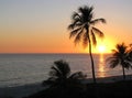 Sunset over tropical beach Royalty Free Stock Photo