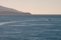 Sunset over a tropical beach bay with boat