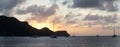 Sunset over Union Island with Sail boat yachts in the Tobago Cays near Saint Vincent and the Grenadines, Caribbean. Royalty Free Stock Photo