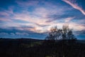 Sunset over the valley with dramatic clouds. Royalty Free Stock Photo