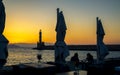 Sunset over The Venetian era harbour and lighthouse at the Mediterranean port of Chania, Crete, Greek Islands, Greece Royalty Free Stock Photo