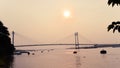 Sunset over Vidyasagar Setu a modern Cantilever Spar Cable-Stayed Bridge in a summer evening on the river Hooghly. Silhouette Royalty Free Stock Photo