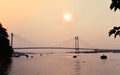 Sunset over Vidyasagar Setu a modern Cantilever Spar Cable-Stayed Bridge in a summer evening on the river Hooghly. Silhouette Royalty Free Stock Photo