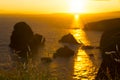 Sunset over the virgin rock with wild tall grass Royalty Free Stock Photo