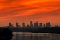 Sunset over the Warsaw city buildings by the Vistula river in Poland. Royalty Free Stock Photo