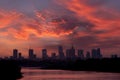 Sunset over the Warsaw city buildings by the Vistula river in Poland. Royalty Free Stock Photo