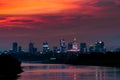 Sunset over the Warsaw city buildings by the Vistula river in Poland. Royalty Free Stock Photo