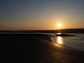 Sunset over water, estuary, mudflats UK.