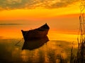 Sunset over water and silhouette fishing boat Royalty Free Stock Photo