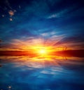 Sunset over water suface Royalty Free Stock Photo