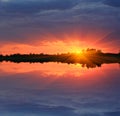Sunset over water surface Royalty Free Stock Photo