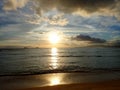 Sunset over the Waters of Waikiki with boats in the ocean and helicopter in the air Royalty Free Stock Photo