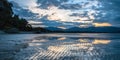 Sunset over Wet Beach in Pohara, Golden Bay, New Zealand