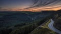 Sunset over a winding, mountain road Royalty Free Stock Photo