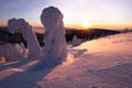 Sunset over the winter landscape from the top of a snowy hill. Royalty Free Stock Photo