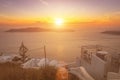 Sunset overlooking the caldera and the sea in the village of Imerovigli on the island of Santorini in the summer. Greece. White Royalty Free Stock Photo
