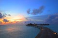 Sunset and overwater villas Royalty Free Stock Photo