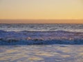 Sunset upon the Pacific ocean, kelp and sea birds, Orange and yellow sky. Boundless waters.