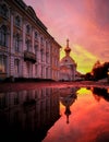 Sunset at palace in Russia with shadow in water on autumn