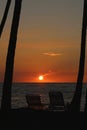 Sunset palm trees chairs Hawaii Royalty Free Stock Photo