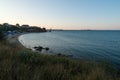 Sunset Panorama of A Black Sea Beach Located near a Field and a Shipyard Royalty Free Stock Photo