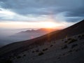 Sunset panorama of mountain range silhouette layers haze dust fog clouds at Misti volcano Arequipa Peru Andes