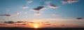 Sunset panorama with raspberry clouds over a small town Royalty Free Stock Photo