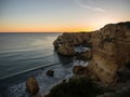 Sunset panorama view of rock cliff coast navy beach Praia da Marinha Caramujeira Lagoa Algarve atlantic ocean Portugal