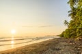 Sunset at paradise beach in Uvita, Costa Rica - beautiful beaches and tropical forest at pacific coast of Costa Rica - travel Royalty Free Stock Photo