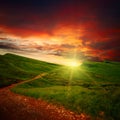 Sunset and path through a meadow Royalty Free Stock Photo