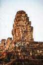 Sunset of Phnom Bakheng, one of the ruined temples of ancient Cambodia.