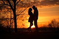 Sunset photo of silhouettes of a couple in love Royalty Free Stock Photo