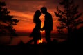 Sunset photo of silhouettes of a couple in love Royalty Free Stock Photo