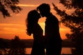 Sunset photo of silhouettes of a couple in love Royalty Free Stock Photo