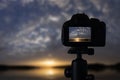 Sunset photography. Camera with tripod Sunset. Sunset.