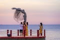 Sunset in Phu Quoc beach with nice view. Tourists, sunbeds and umbrellas on beautiful day in Sanato beach Royalty Free Stock Photo