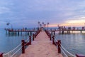 Sunset in Phu Quoc beach with nice view. Tourists, sunbeds and umbrellas on beautiful day in Sanato beach Royalty Free Stock Photo