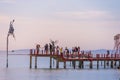 Sunset in Phu Quoc beach with nice view. Tourists, sunbeds and umbrellas on beautiful day in Sanato beach Royalty Free Stock Photo