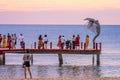 Sunset in Phu Quoc beach with nice view. Tourists, sunbeds and umbrellas on beautiful day in Sanato beach Royalty Free Stock Photo