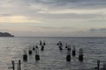 Sunset from a pier on the beach Royalty Free Stock Photo