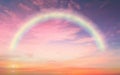 Sunset pink and  blue sky  with rainbow at sky ,fluffy clouds skyline beautiful landscape background   summer  nature Royalty Free Stock Photo