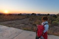 Sunset on the plateau at Blyde River Canyon, famous travel destination in South Africa. One person using smart phone. Royalty Free Stock Photo