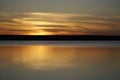 Sunset on the Plavno lake in the Berezinsky nature reserve. Horizon and ref lection. Red paints a bright sky.