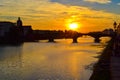 Sunset in Ponte alla Carraia alla Carraia Bridge through Arno
