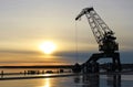 Sunset at the port crane Royalty Free Stock Photo