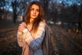 Sunset portrait of beautiful brunette young woman in autumn park Royalty Free Stock Photo