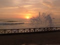 Sunset in Pulpos with splashing wave