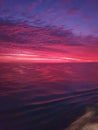 Sunset purple water reflection light sky dusk red sunlight ocean Royalty Free Stock Photo